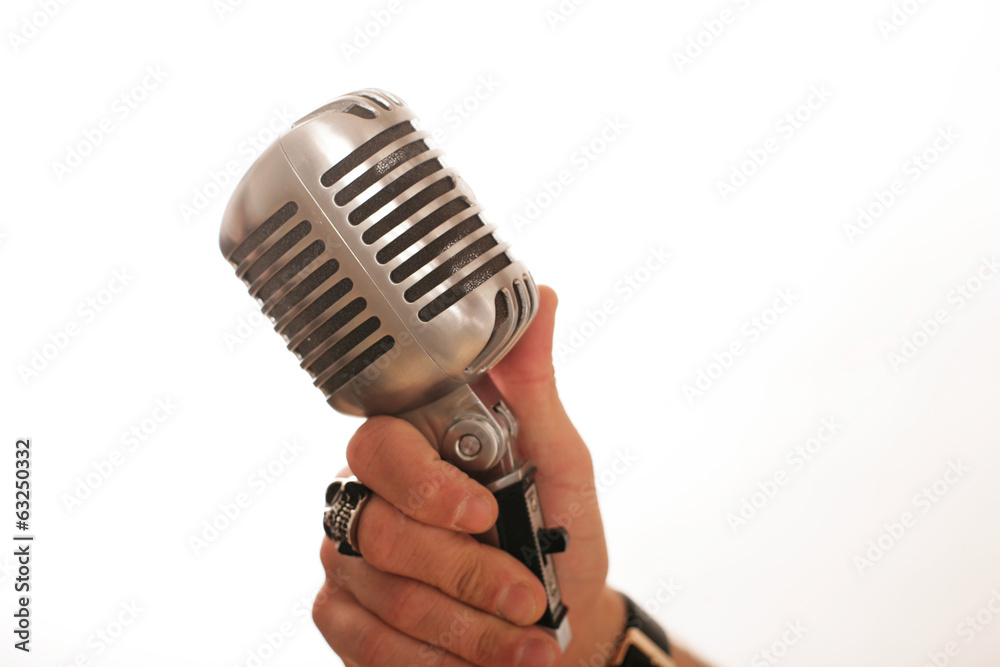 retro Mikrofon in der Hand Stock Photo | Adobe Stock