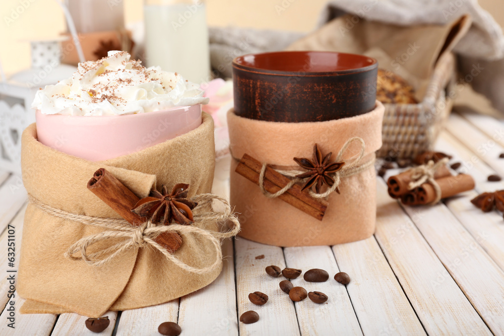 Mug of hot drink decorated in felt on wooden table Mug of hot drink decorated in felt on wooden table