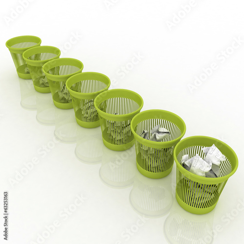 row of baskets for garbage, from complete to empty photo