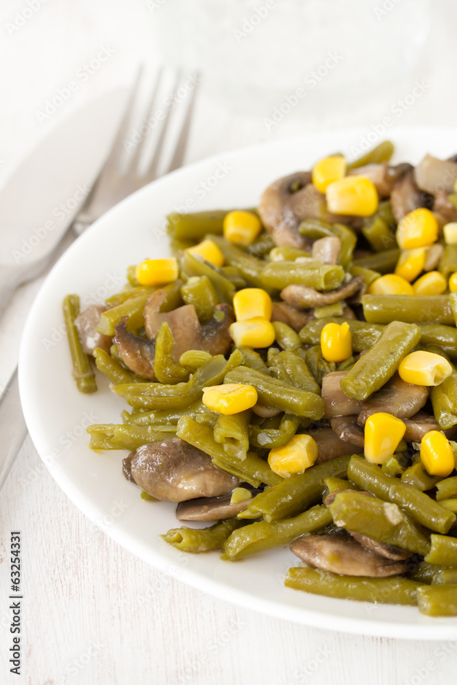 green beans with mushrooms and corn on plate green beans with mushrooms and corn on plate