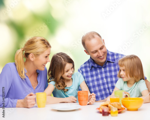 happy family with two kids with having breakfast
