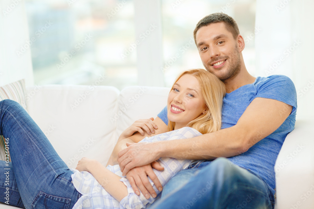 smiling happy couple at home