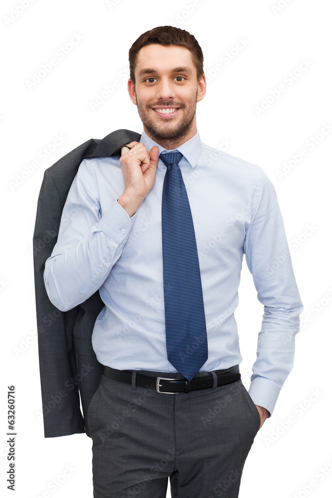 handsome buisnessman with jacket over shoulder handsome buisnessman with jacket over shoulder