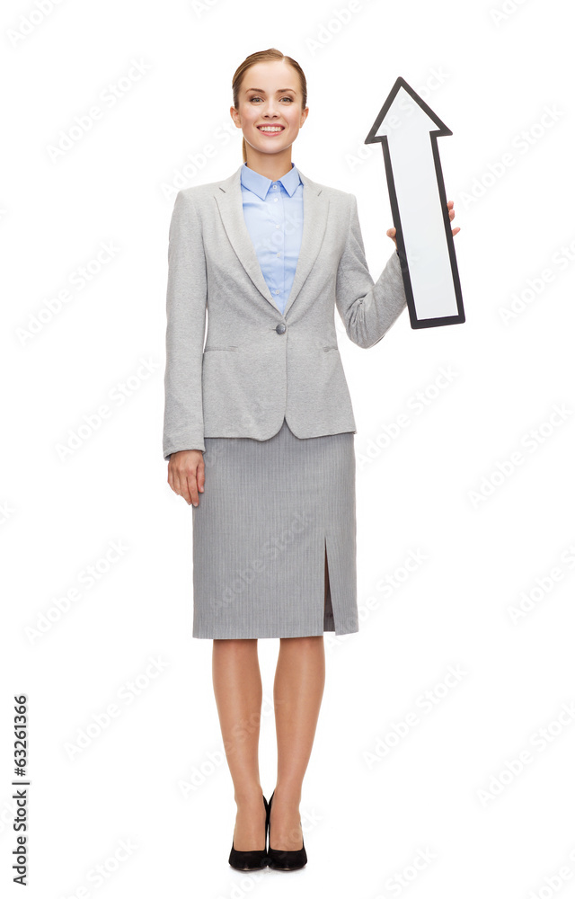 smiling businesswoman with direction arrow sign smiling businesswoman with direction arrow sign