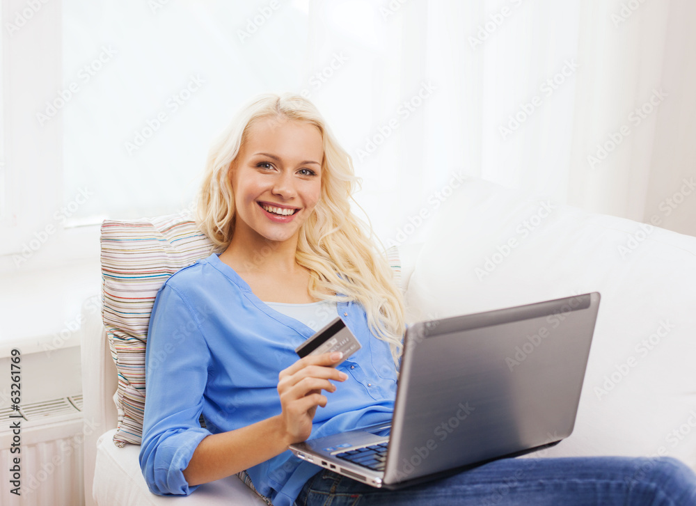 smiling woman with laptop computer and credit card smiling woman with laptop computer and credit card