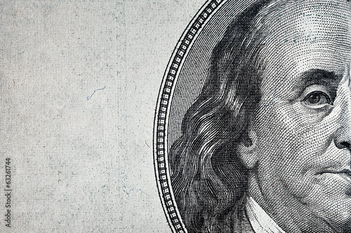 Dollars closeup..Detail of a Benjamin Franklin's portrait photo