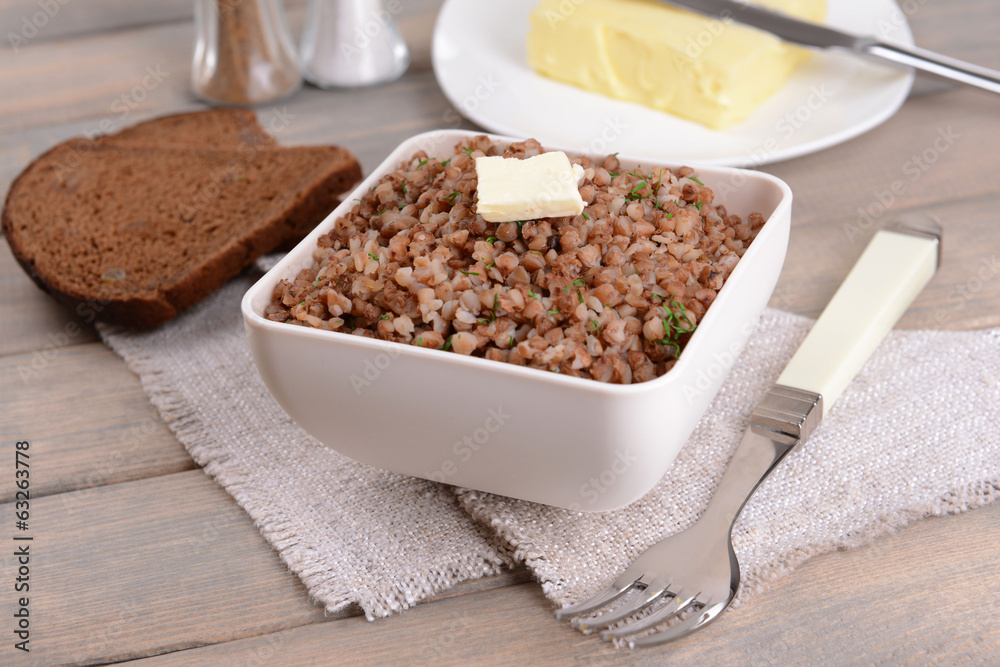 Boiled buckwheat in bowl on table close-up Boiled buckwheat in bowl on table close-up