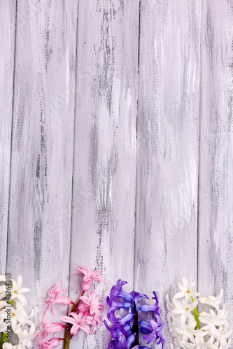 Beautiful hyacinths on color wooden background © Africa Studio