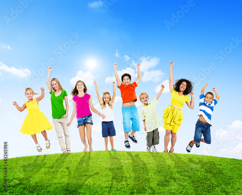 Cheerful Children and Women Raising Their Arms Outdoors