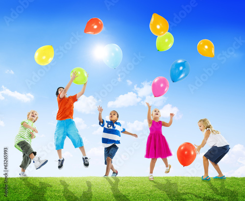 Multi-Ethnic Children Outdoors Playing Balloons Together