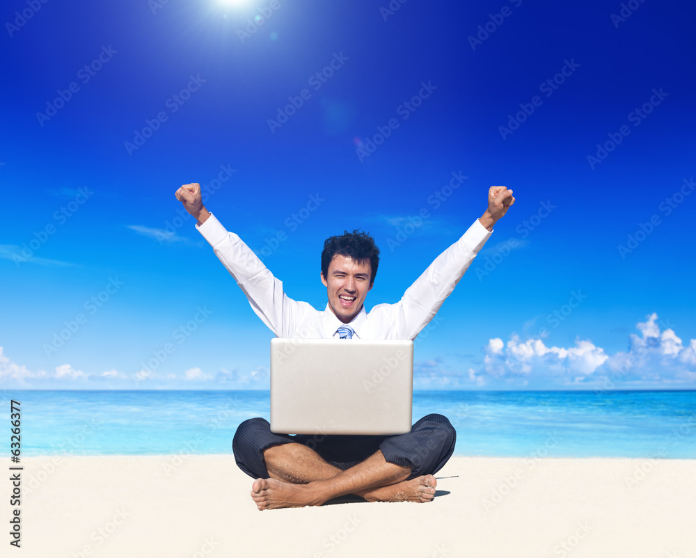 Business Man on Beach with Laptop