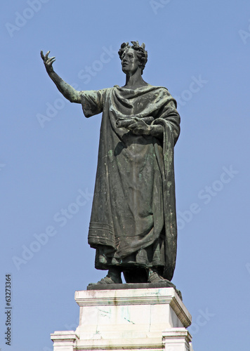 great statue of the famous poet Virgil in the Center in the city photo