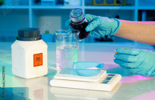 researchers work in modern scientific lab. Preparation of hazard