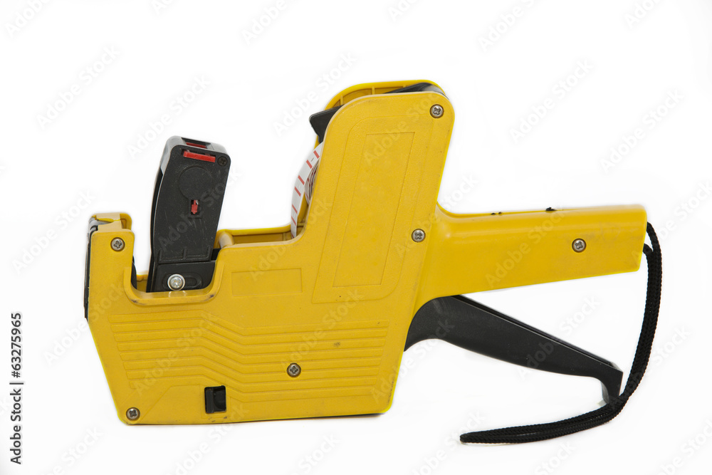 Naklejka premium Yellow plastic price label gun on white