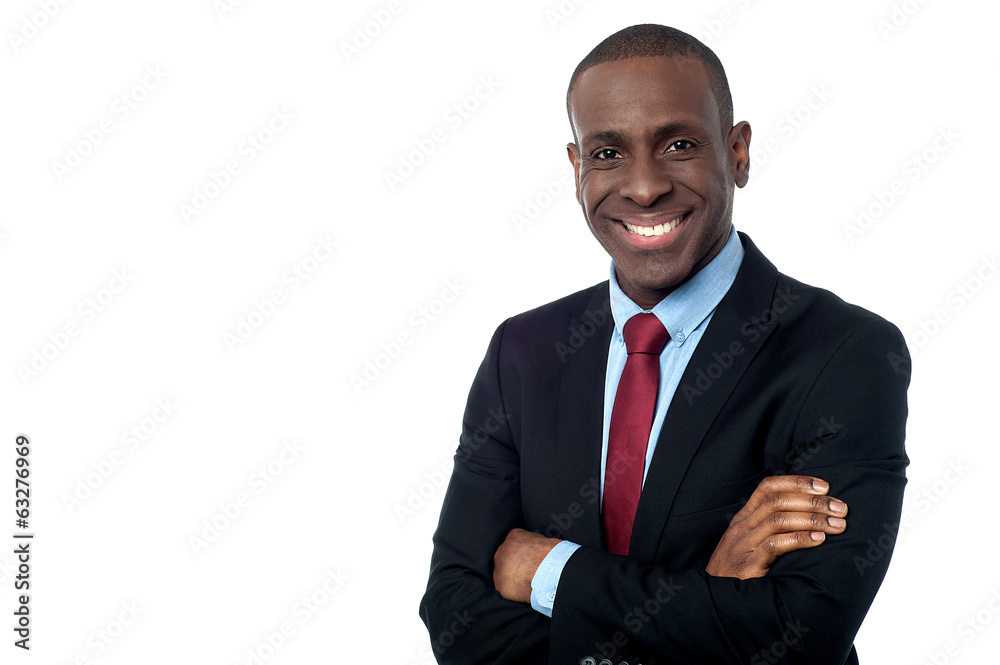 Smiling businessman with arms crossed Smiling businessman with arms crossed