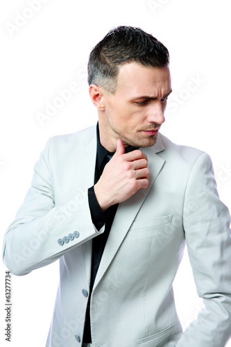 Pensive businessman looking away isolated on a white background