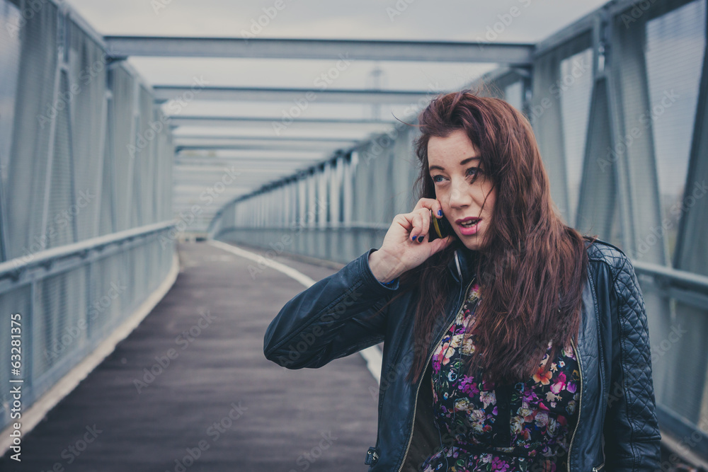 Pretty girl with long hair talking on phone