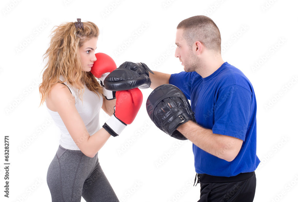 Kickboxing girl with trainer in sparring Kickboxing girl with trainer in sparring