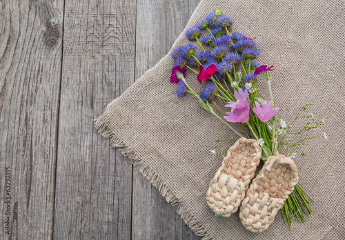 Rural still life with a bouquet of blue flowers and decorative s photo