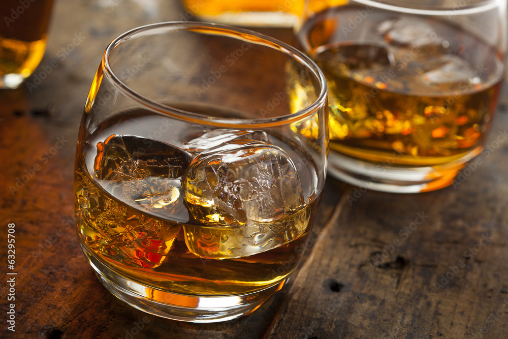Alcoholic Whiskey Bourbon in a Glass with Ice Alcoholic Whiskey Bourbon in a Glass with Ice