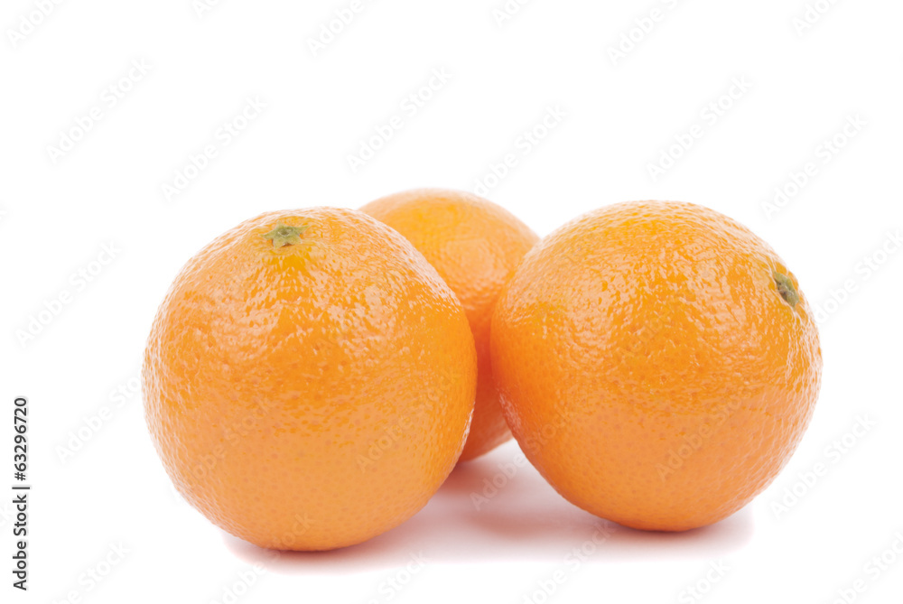 Fresh ripe tangerines on a white background. Fresh ripe tangerines on a white background.