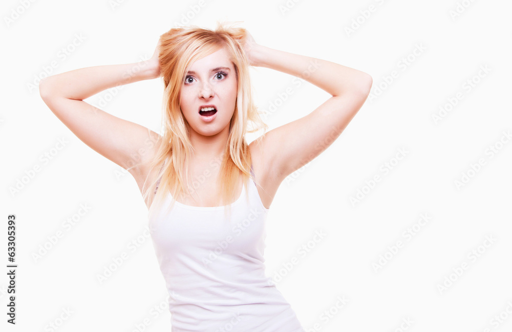 Stress. Young woman frustrated pulling her hair on white Stress. Young woman frustrated pulling her hair on white