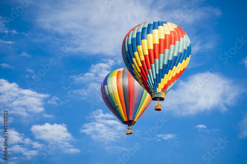 Fotografie, Tablou Beautiful Hot Air Balloons Against a Deep Blue Sky