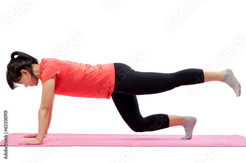 Woman exercising isolated on white