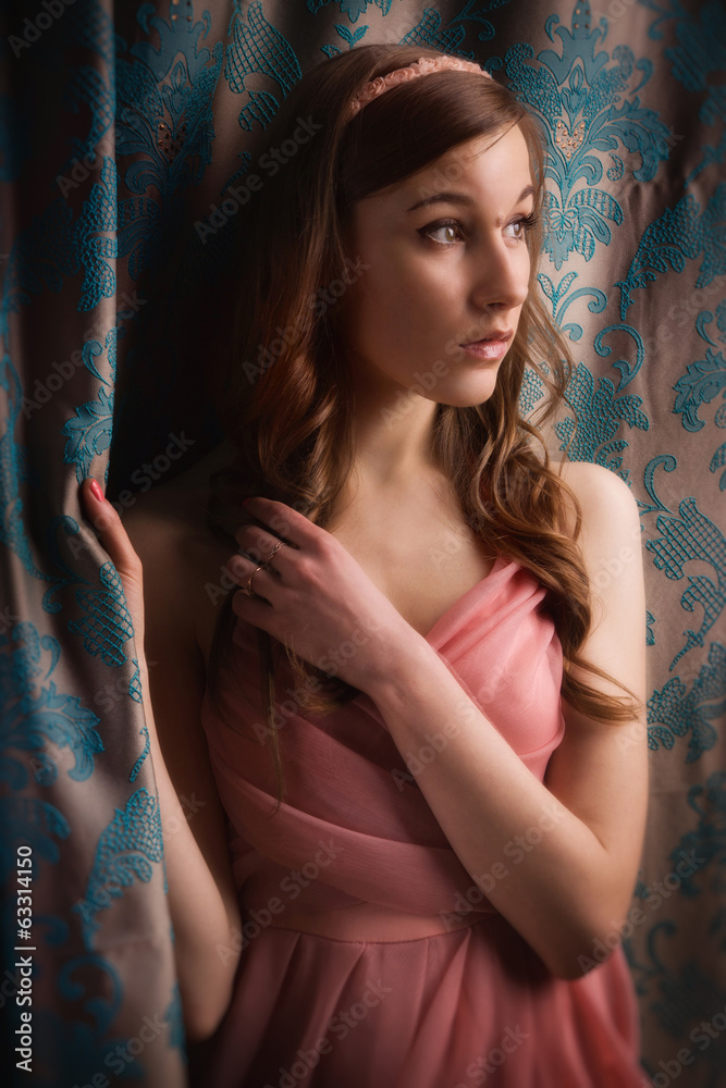 Obraz premium Beautiful young girl in the vintage interior