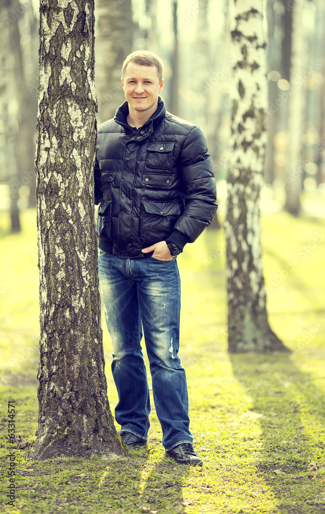 Portrait of a young man in the park