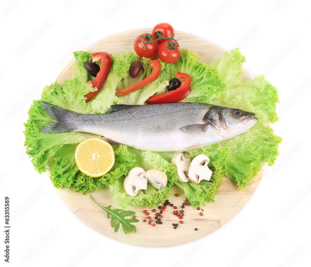 Fresh seabass on platter with lettuce Fresh seabass on platter with lettuce