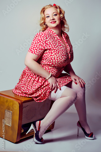 pin up girl posing blue white background