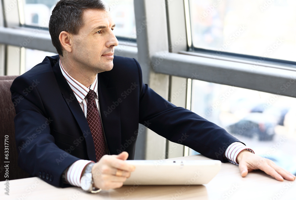 Fototapeta premium Business man looking away in window