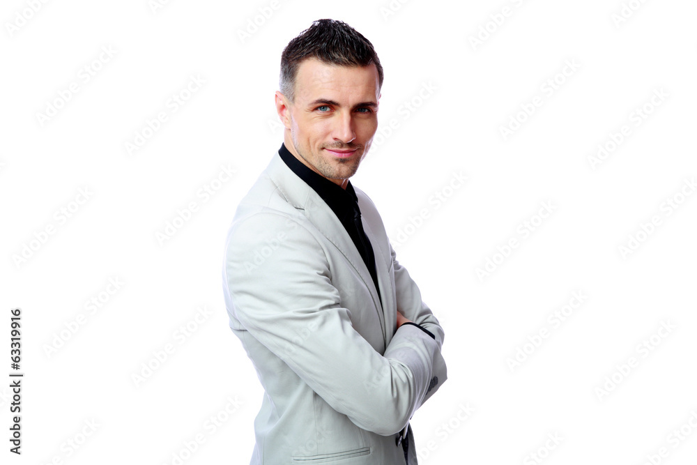 Happy businessman standing with arms folded Happy businessman standing with arms folded