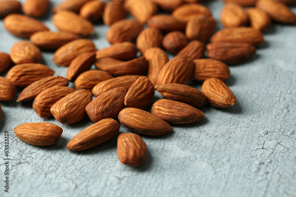 Almonds on color wooden background Almonds on color wooden background
