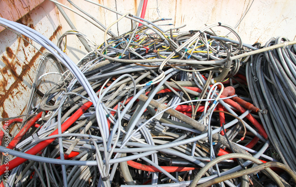 Hank of cord amassed in a container in waste landfill