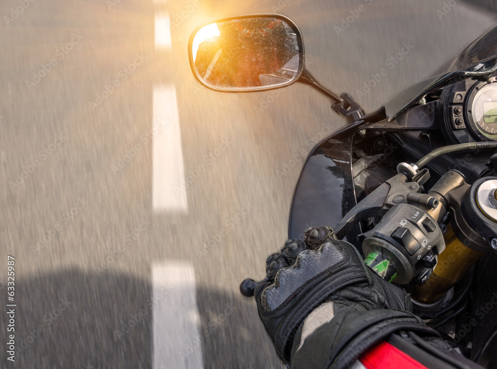 Naklejka premium motorbike riding on the highway