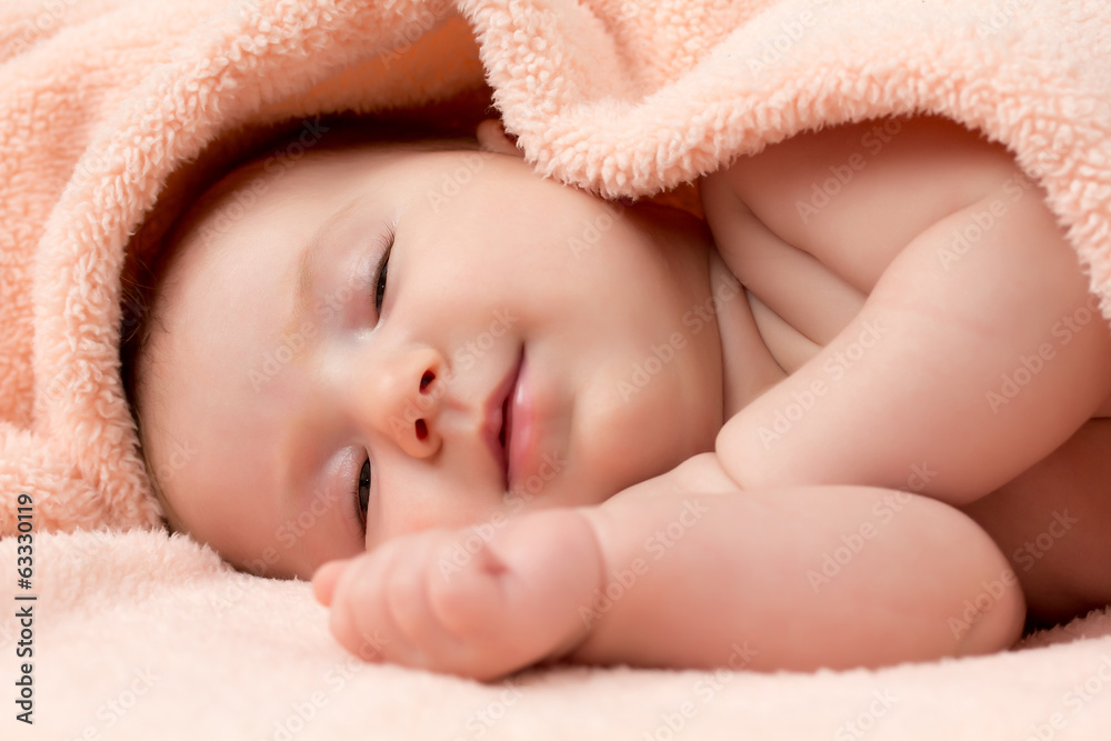 Adorable newborn baby girl is falling asleep Adorable newborn baby girl is falling asleep