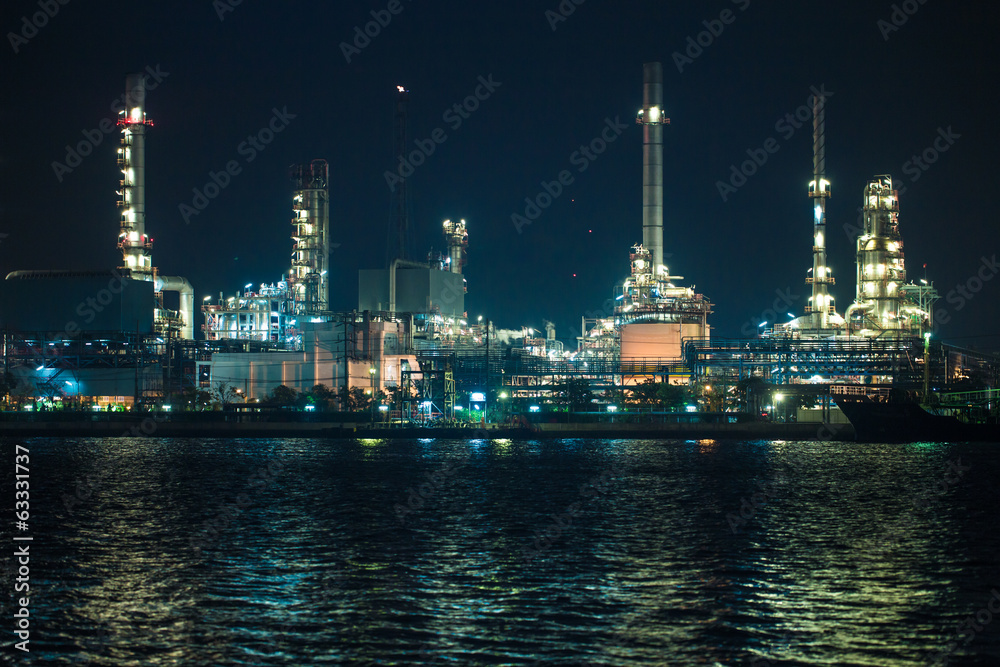 scenic of petrochemical oil refinery plant shines at night