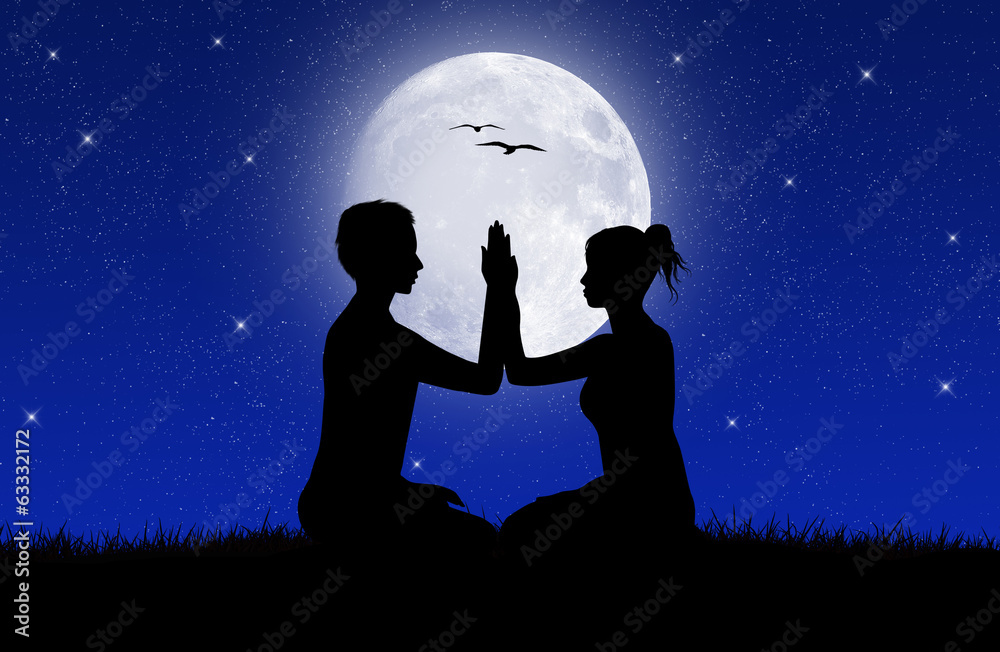 couple doing yoga in the moonlight