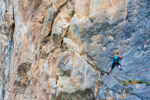 Female climber on a cliff