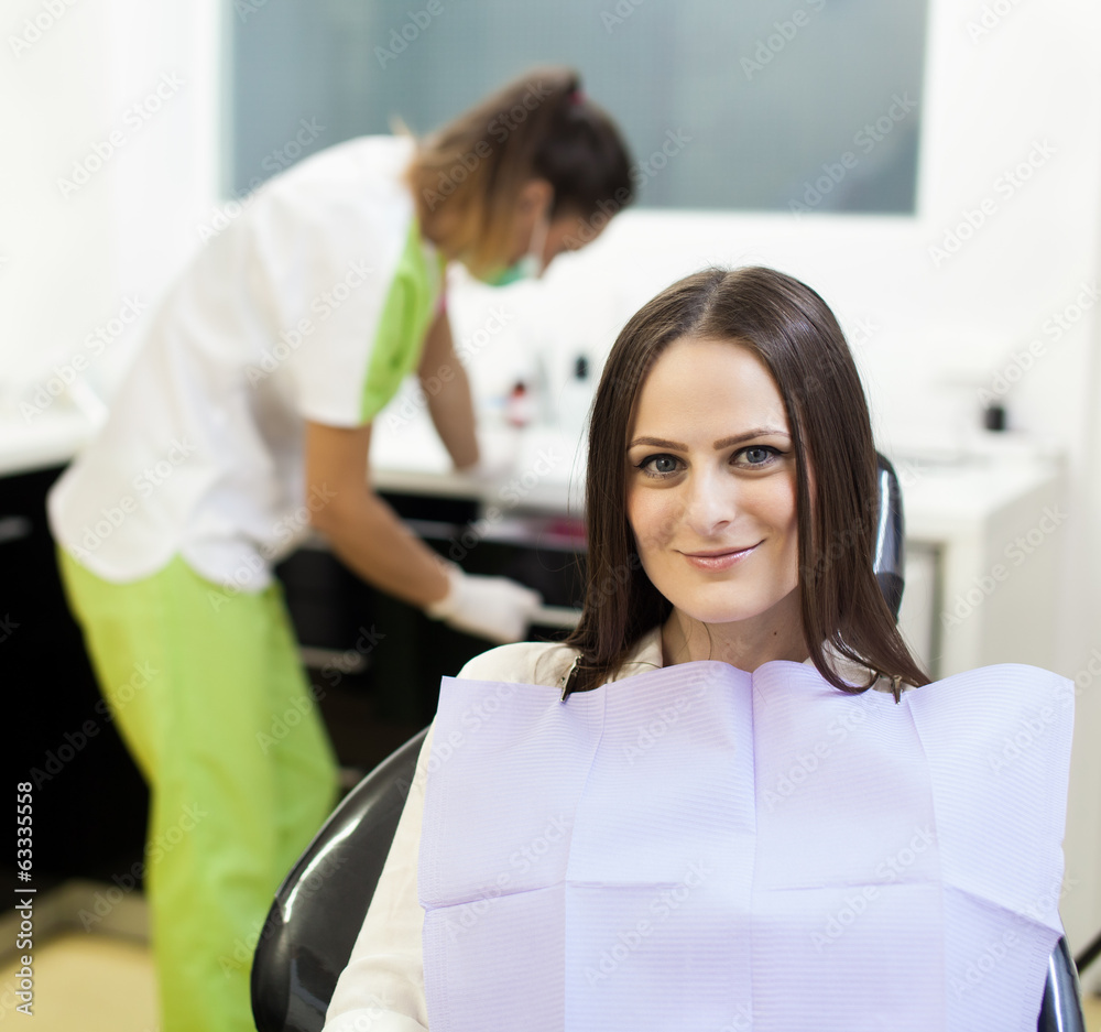 Woman patient at the dentist waiting to be checked up Woman patient at the dentist waiting to be checked up