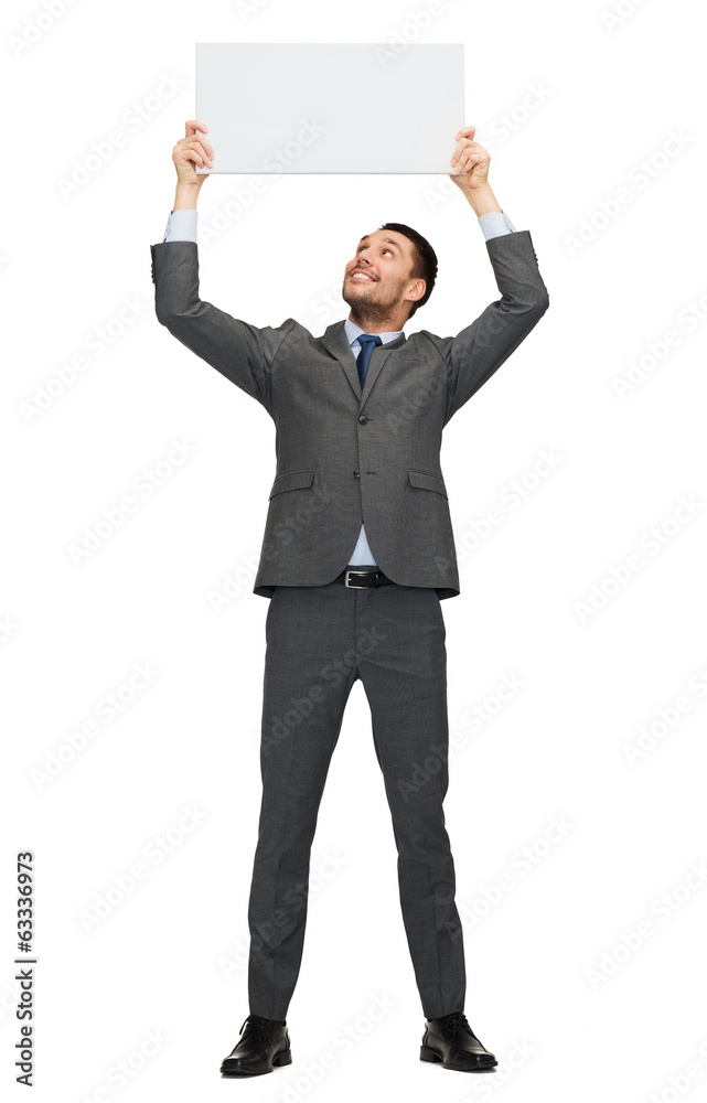 smiling businessman with white blank board smiling businessman with white blank board
