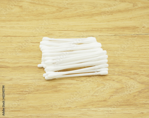 Cotton bud on wooden table