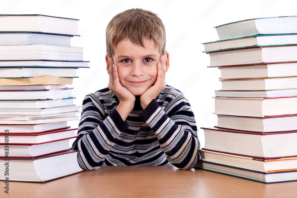 Schoolboy and a heap of books Schoolboy and a heap of books