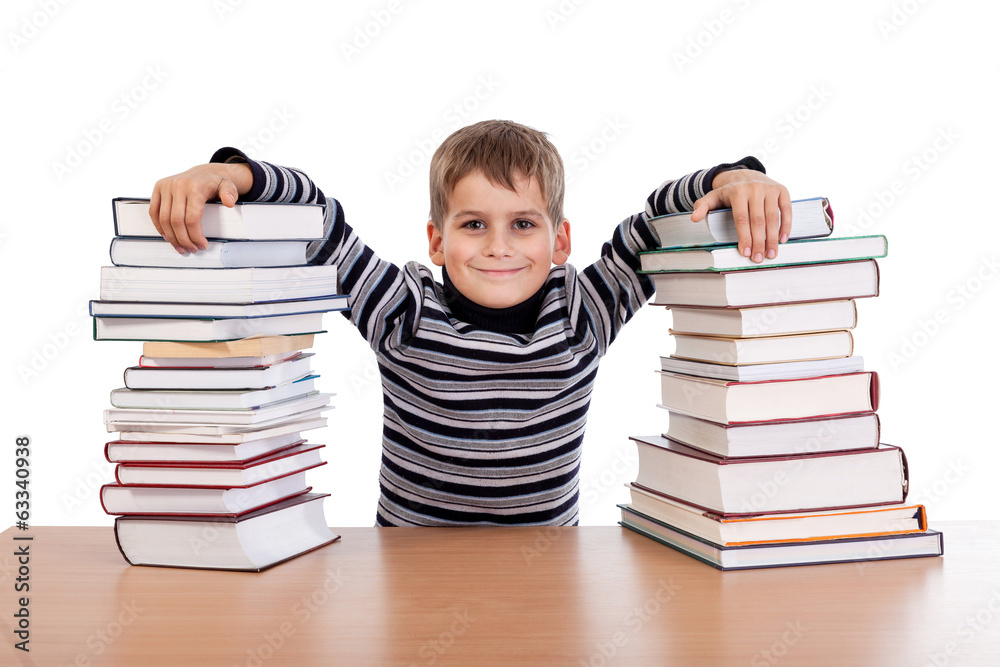 Schoolboy and a heap of books