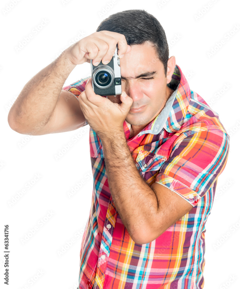Hispanic man using a compact camera isolated on white Hispanic man using a compact camera isolated on white