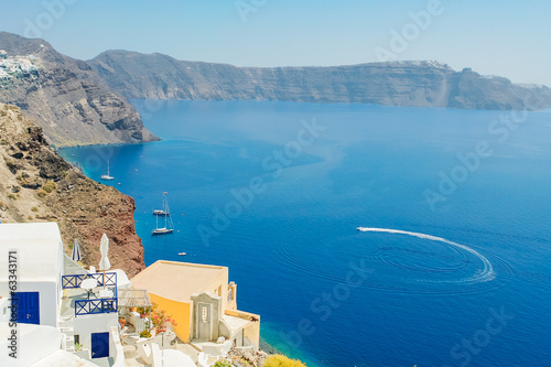 View of the sea with the high coast of the island of Santorini