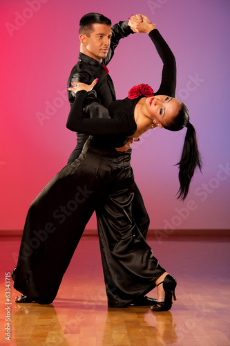  Professional ballroom dance couple preform an exhibition dance photo