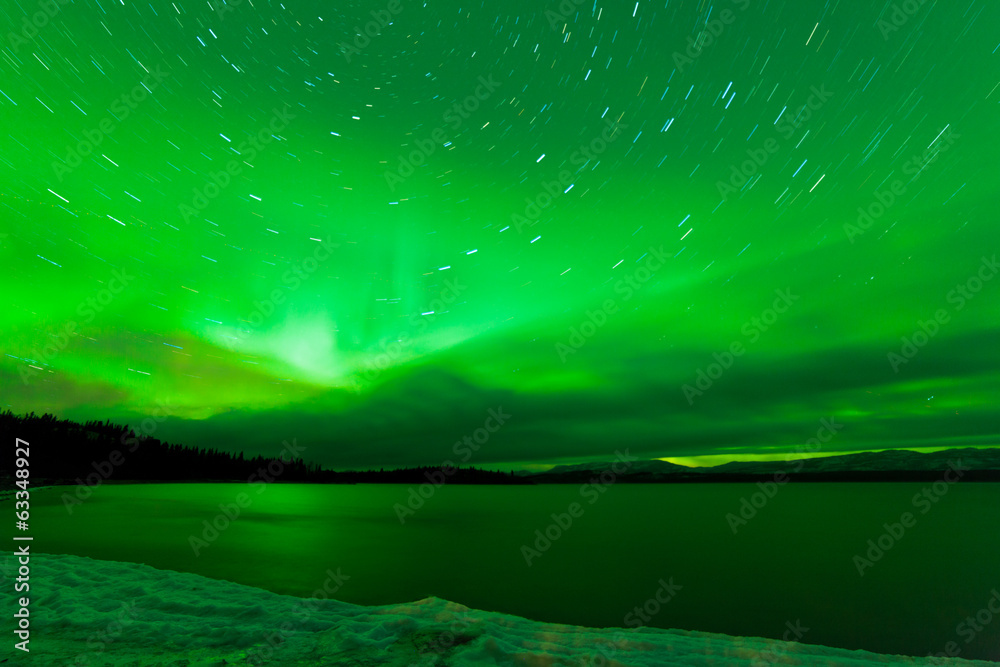 Aurora borealis starry night sky over Lake Laberge